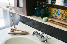 BAMWOO bamboo toothbrushes in a bathroom in a villa in Bali