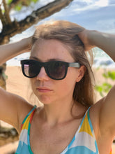 Girl wearing BAMWOO bamboo's Jungle Sunglasses in dark Bamboo