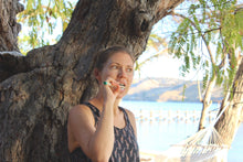 Girl brushing teeth with a BAMWOO bamboo toothbrush at The Seraya, an island in Komodo National Park, Indonesia