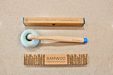 BAMWOO children's bamboo toothbrush in ocean blue with blue ceramic toothbrush holder